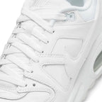 Macro focus on the forefoot and eyestay, detailing the fine leather grain, double-needle stitch lines along the overlay panels, and the clean lace eyelets.