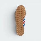 Displays the classic textured grid pattern of the vintage gum rubber outsole, engineered for unreal everyday multi-surface street grip.