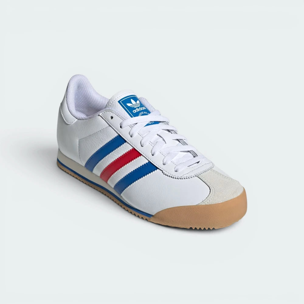 Emphasising the low-profile track silhouette and the professional distribution of the bright blue and red branding accents.