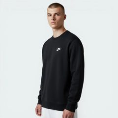 Man wearing a black Nike sweatshirt on a white background
