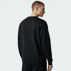 Person wearing a black sweatshirt on a light gray background