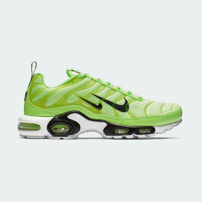 Side profile of Nike Air Max Plus Men's "Lime Blast" trainers, showcasing the vibrant lime and black colourway, visible Tuned Air unit, and wavy upper design. Main image