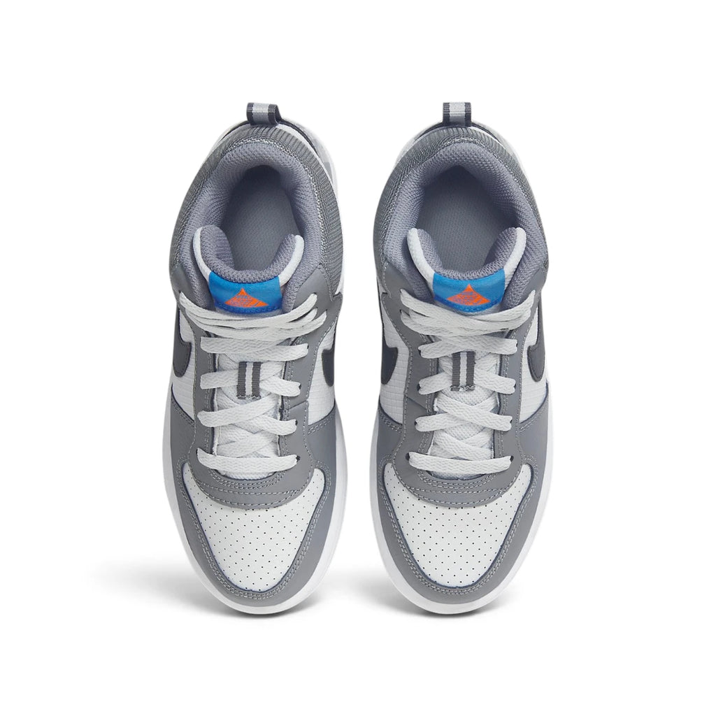 Overhead top-down view looking down at the laced sneakers, displaying the white flat laces, textile tongue with blue and orange branding tags, and cushioned grey collar openings.