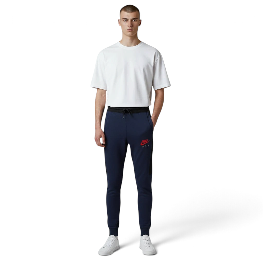 Person wearing navy jogger pants with a red logo and a white t-shirt on a white background Main image