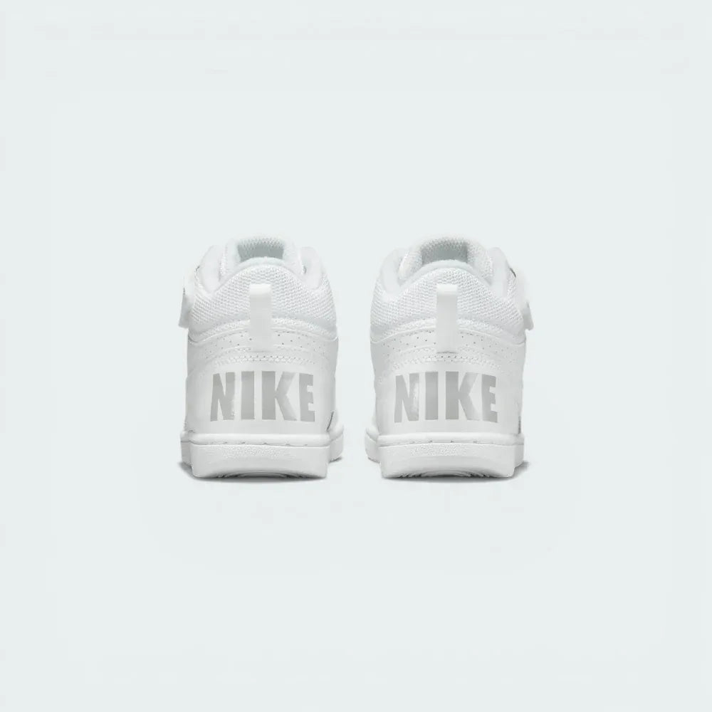 Rear view of the trainers, focusing on the "NIKE" branding on the heel and the padded ankle collar.