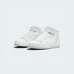 Three-quarter view of the pair, emphasizing the clean, all-white leather construction and structured heel.