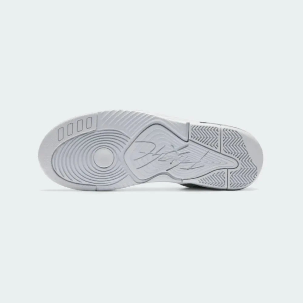 View of the outsole of the Jordan Flight Origin 4 Men's grey basketball shoes, showing the durable rubber tread pattern for multi-directional traction.