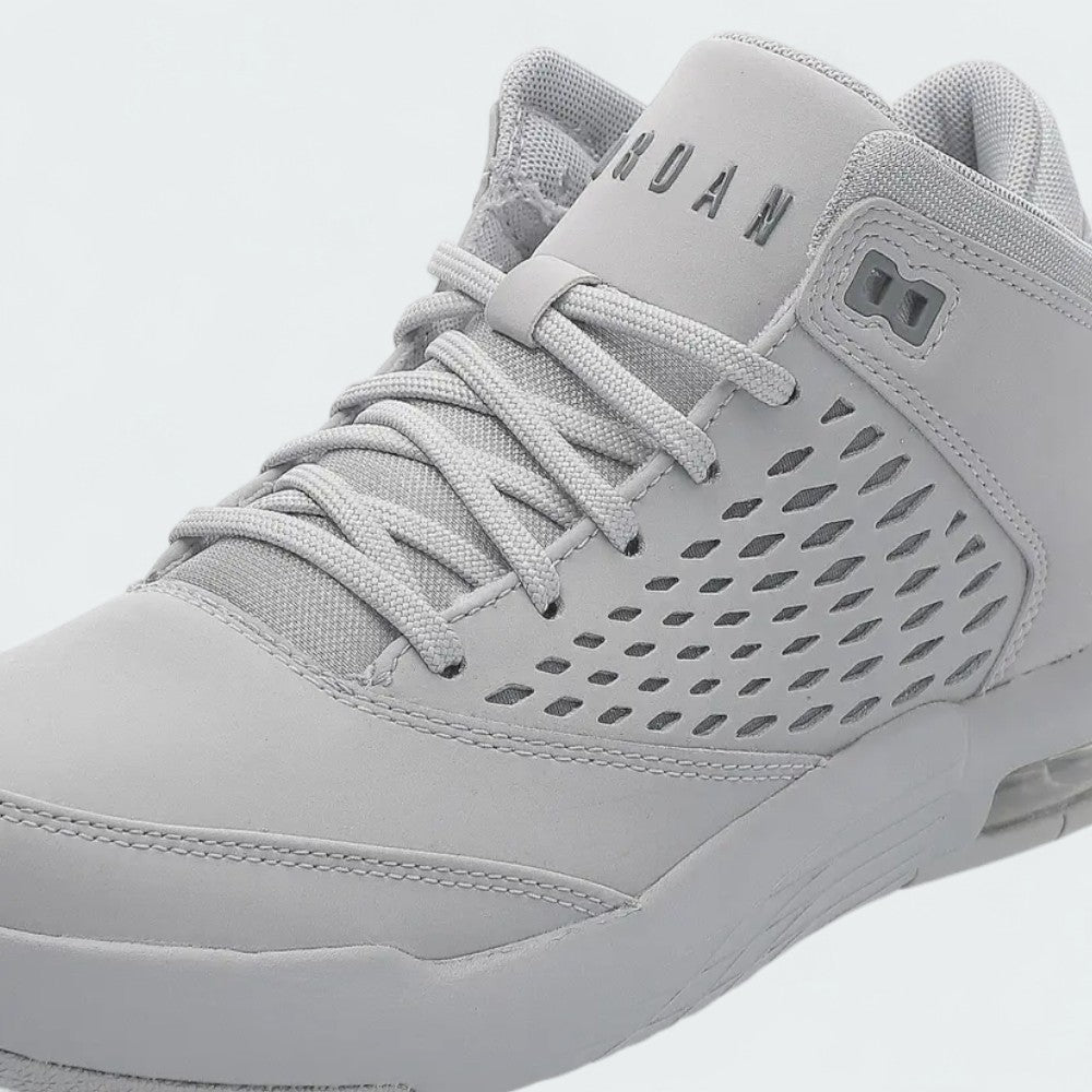 Close-up zoom on the front of the Jordan Flight Origin 4 Men's grey basketball shoes, showing the perforated toe box, lacing system, and textured upper.
