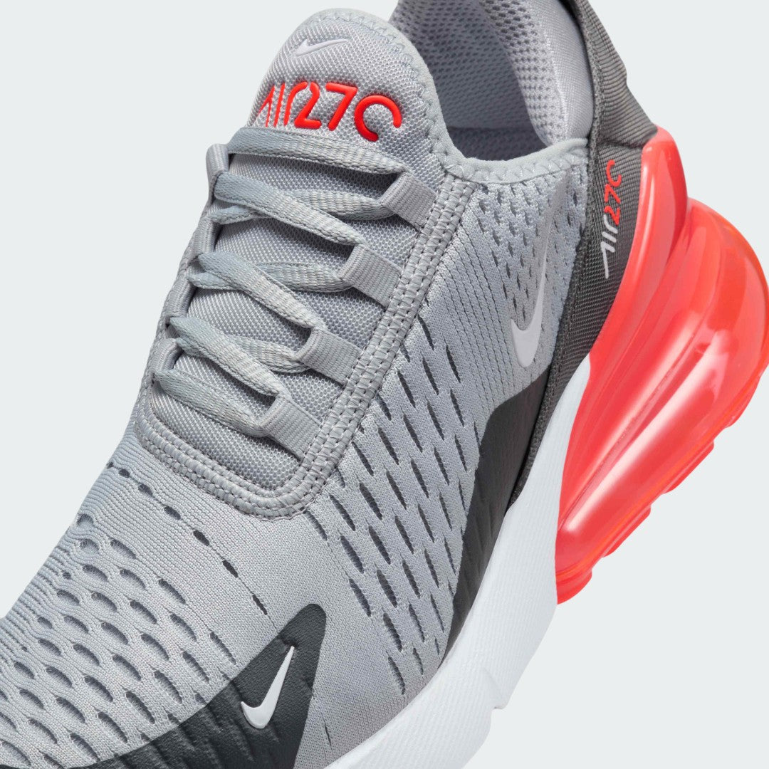 Close-up zoom on the front of the Nike Air Max 270 Juniors' trainers, showing the mesh toe box, lacing system, and synthetic overlays.