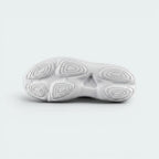 Displays the specialized lightweight flex grooves tracing across the foam outsole base, engineered for unreal multidirectional playground flexibility and grip.