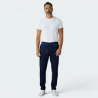 Highlights the tapered leg silhouette and the professional finish of the tonal navy 3-Stripes.