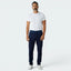 Highlights the tapered leg silhouette and the professional finish of the tonal navy 3-Stripes.