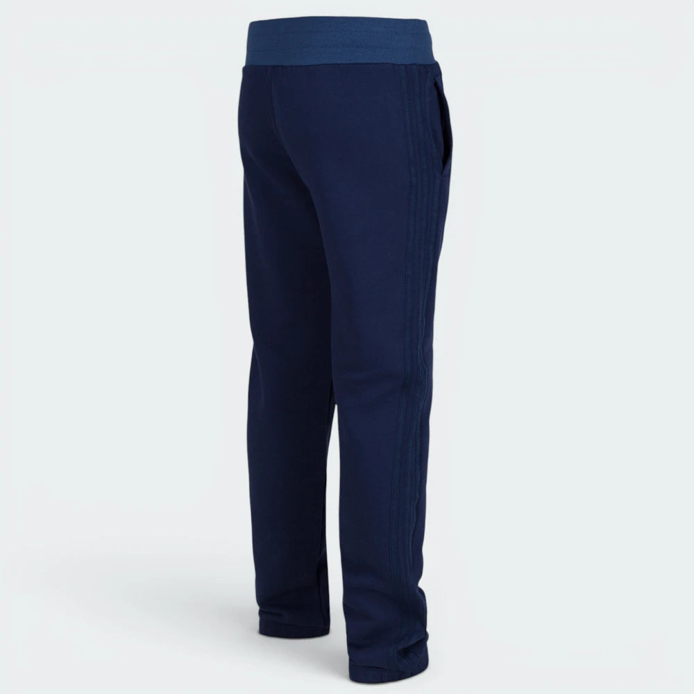Focusing on the clean back silhouette and the professional finish of the cuffed ankles.