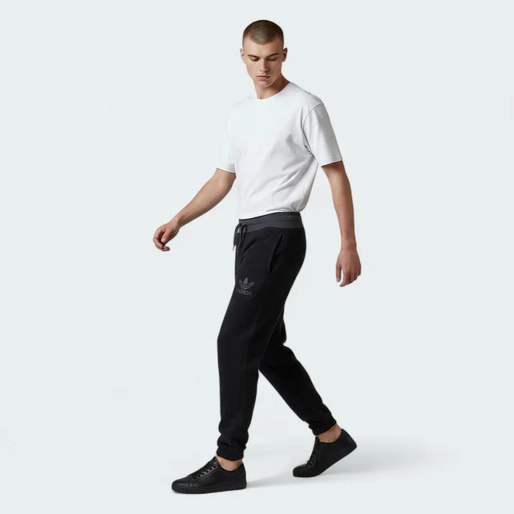Focuses on the tightly stitched elastic ribbing and the professional alignment of the internal drawcord engineered for a custom, locked-in fit.
