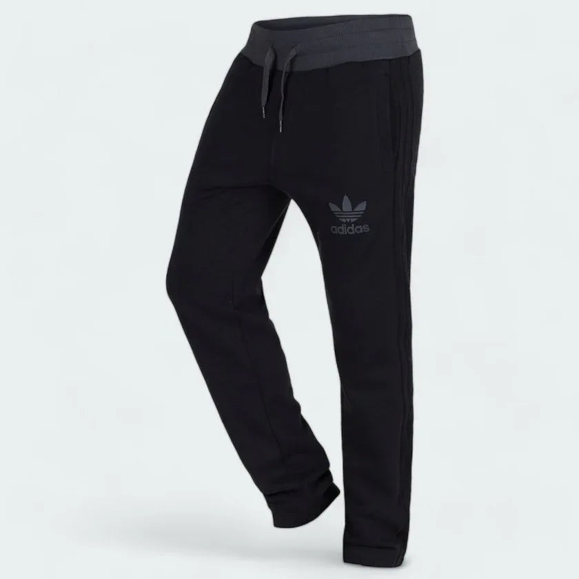 Emphasising the sharp visual pop of the grey fabric bands sewn perfectly parallel down the leg columns for a classic track aesthetic.