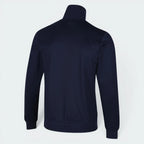 Focuses on the clean, unadorned back panel of the jacket, highlighting the sharp drop of the raglan shoulder seams and the consistent rich tone of the navy blue double-knit fabric.