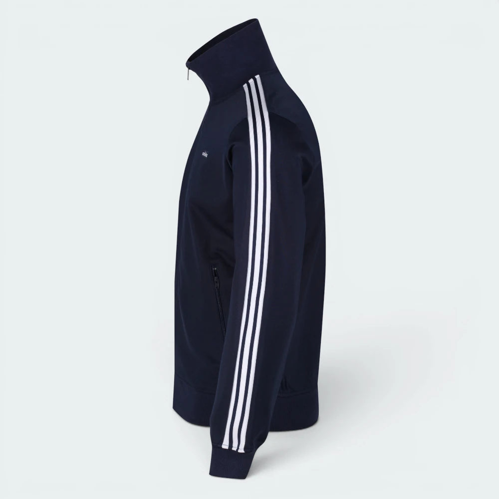 Focuses on the symmetry of the flat-laid track jacket, displaying the perfect alignment of the high stand-up collar, the white zip track, and the balance of the embroidered Trefoil logo.