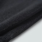 Displays a close-up of the blank black terry loop area when folded, showcasing the deep, comfortable pile of the weave engineered for maximum moisture absorption.