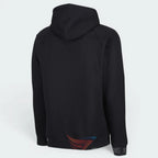 Focusing on the clean back silhouette and the professional finish of the raglan shoulder construction.