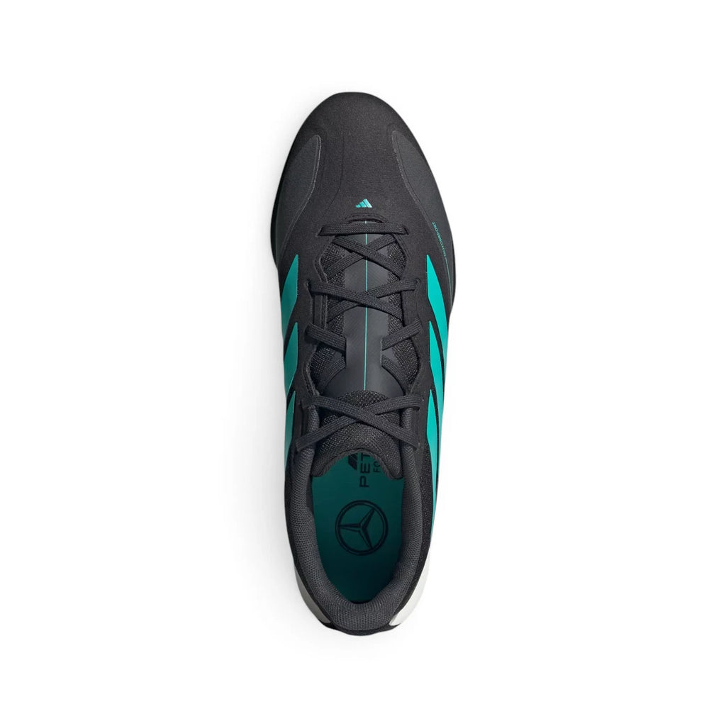 Overhead view looking down at the laced black trainers, displaying the flat black laces, technical tongue construction, and mint insole featuring the Mercedes-AMG star logo.