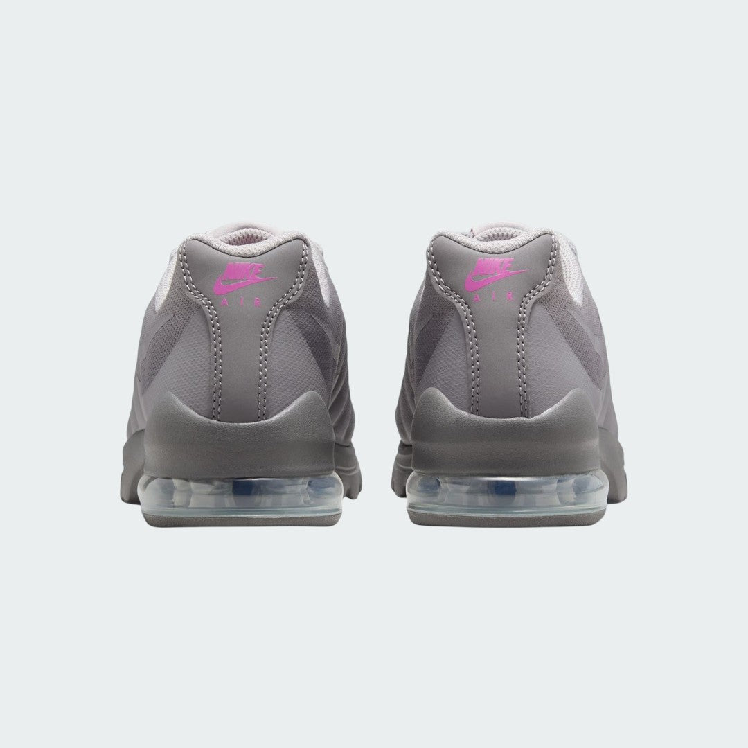 Rear view of the Nike Air Max Invigor Print Girls' black trainers, focusing on the visible Max Air unit in the heel and subtle branding.