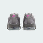 Rear view of the Nike Air Max Invigor Print Girls' black trainers, focusing on the visible Max Air unit in the heel and subtle branding.
