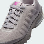 Close-up zoom on the front of the Nike Air Max Invigor Print Girls' trainers, showing the mesh toe box with a floral print, lacing system, and synthetic overlays.