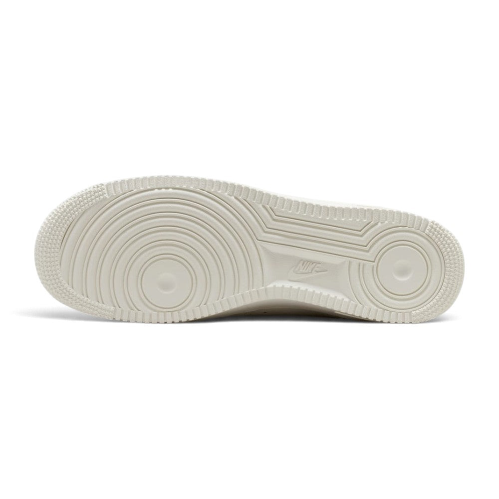 Full-length bottom profile showing the waffle-inspired rubber outsole, highlighting the strategic traction pods, flex grooves designed for smooth heel-to-toe transition, and carved arch channels.