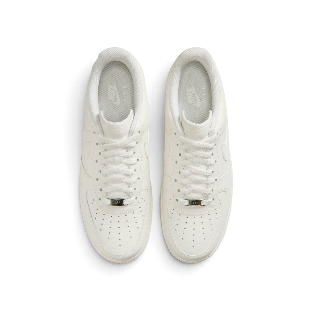 Direct overhead view of both shoes laid flat, showcasing the breathable forefoot mesh, flat pink laces threaded through supportive eyestay loops, custom graphic insoles, and cushioned collar openings.