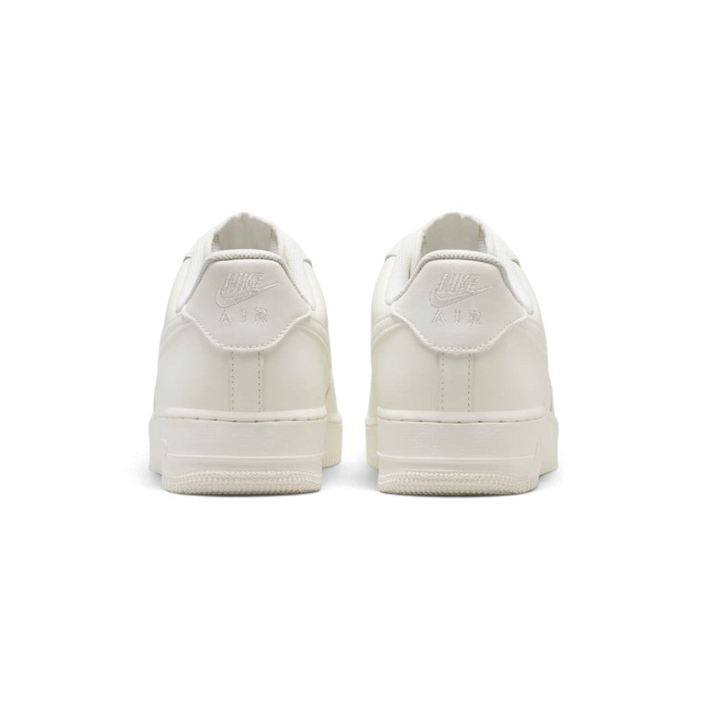 Close-up rear angle focusing on the supportive Pink Oxford heel counters, the tapered white midsole flare, and the vertical reflective rear strip designed for night-running visibility.