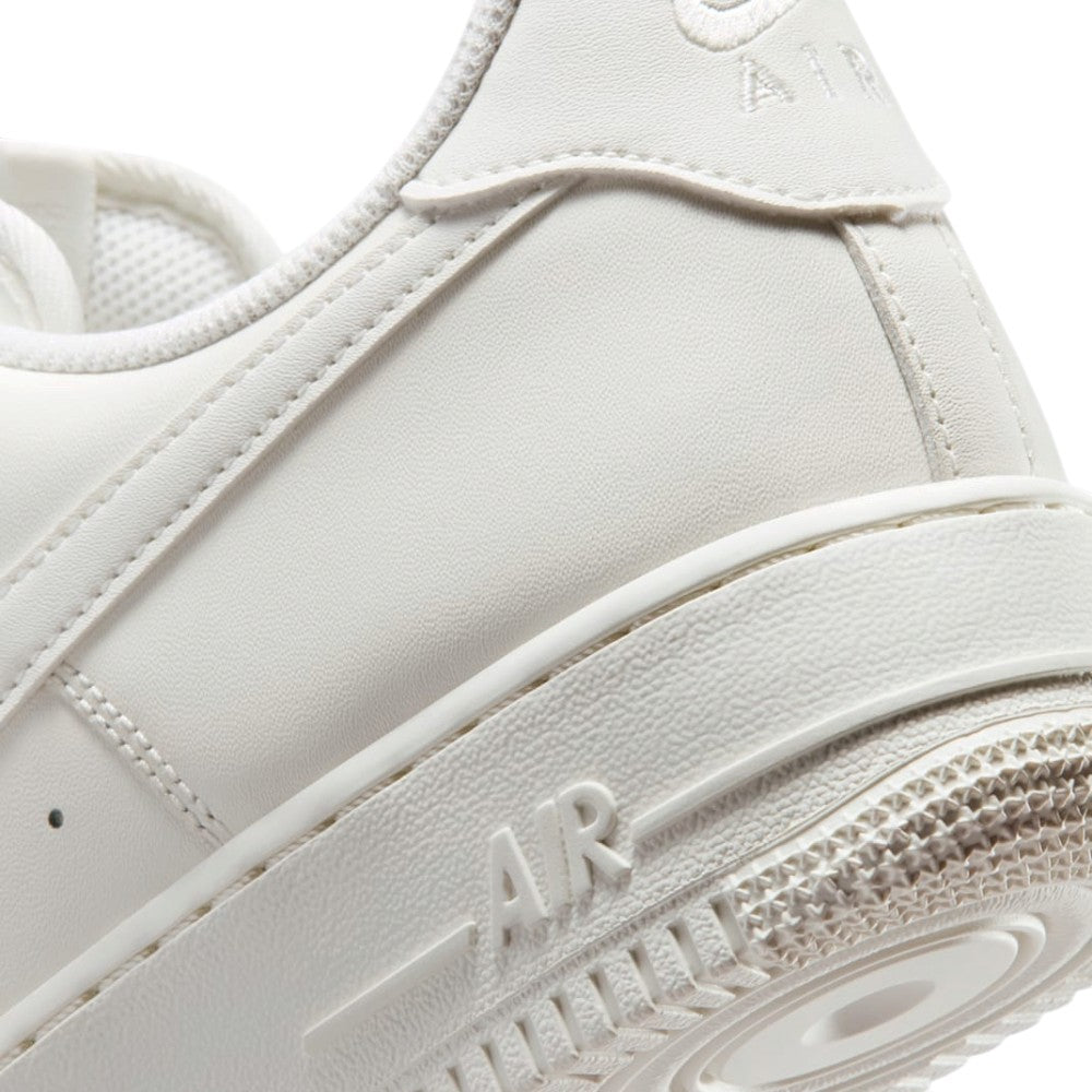 Macro view of the lateral heel transition, highlighting the fine geometric texture moulded into the React foam midsole sidewall and the clean integration into the rubber outsole tread.