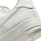 Macro view of the lateral heel transition, highlighting the fine geometric texture moulded into the React foam midsole sidewall and the clean integration into the rubber outsole tread.