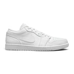 Side profile of the Air Jordan 1 Low in all-white showing genuine leather upper, encapsulated Air-Sole unit, and solid rubber outsole.