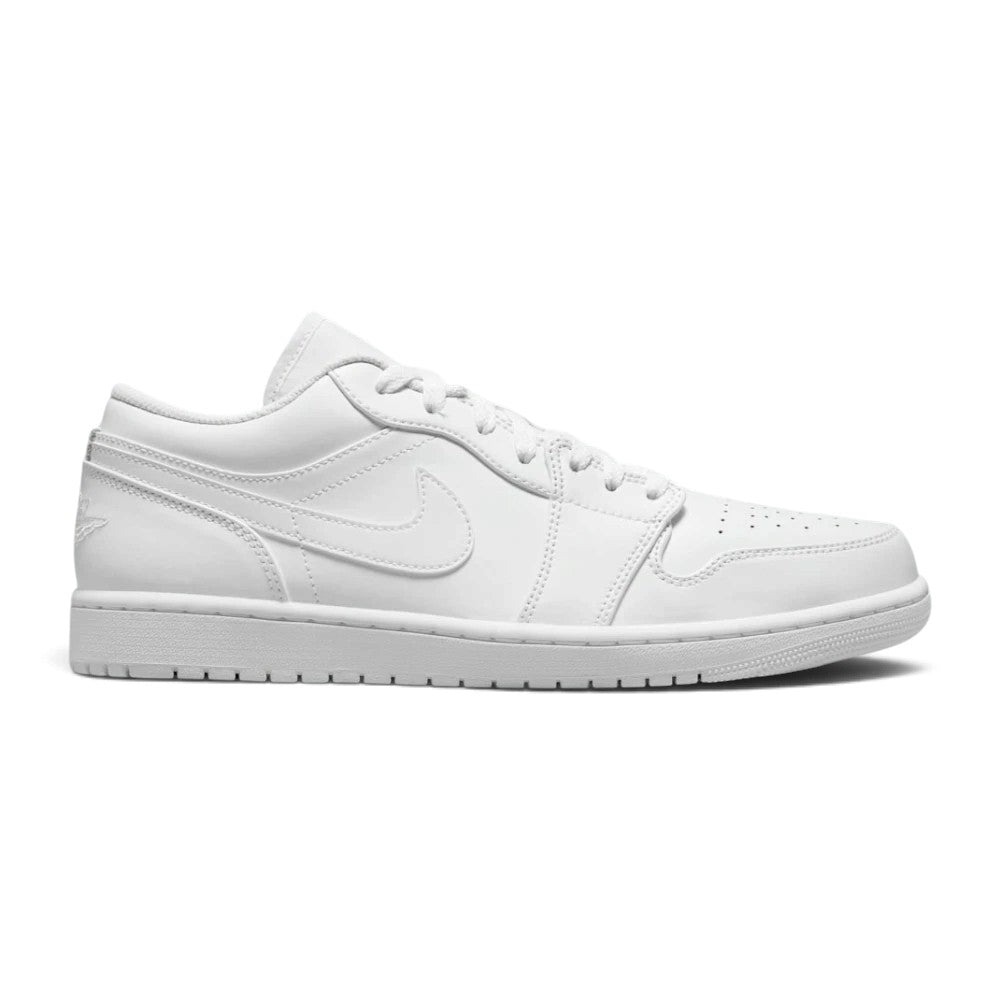 Side profile of the Air Jordan 1 Low in all-white showing genuine leather upper, encapsulated Air-Sole unit, and solid rubber outsole.