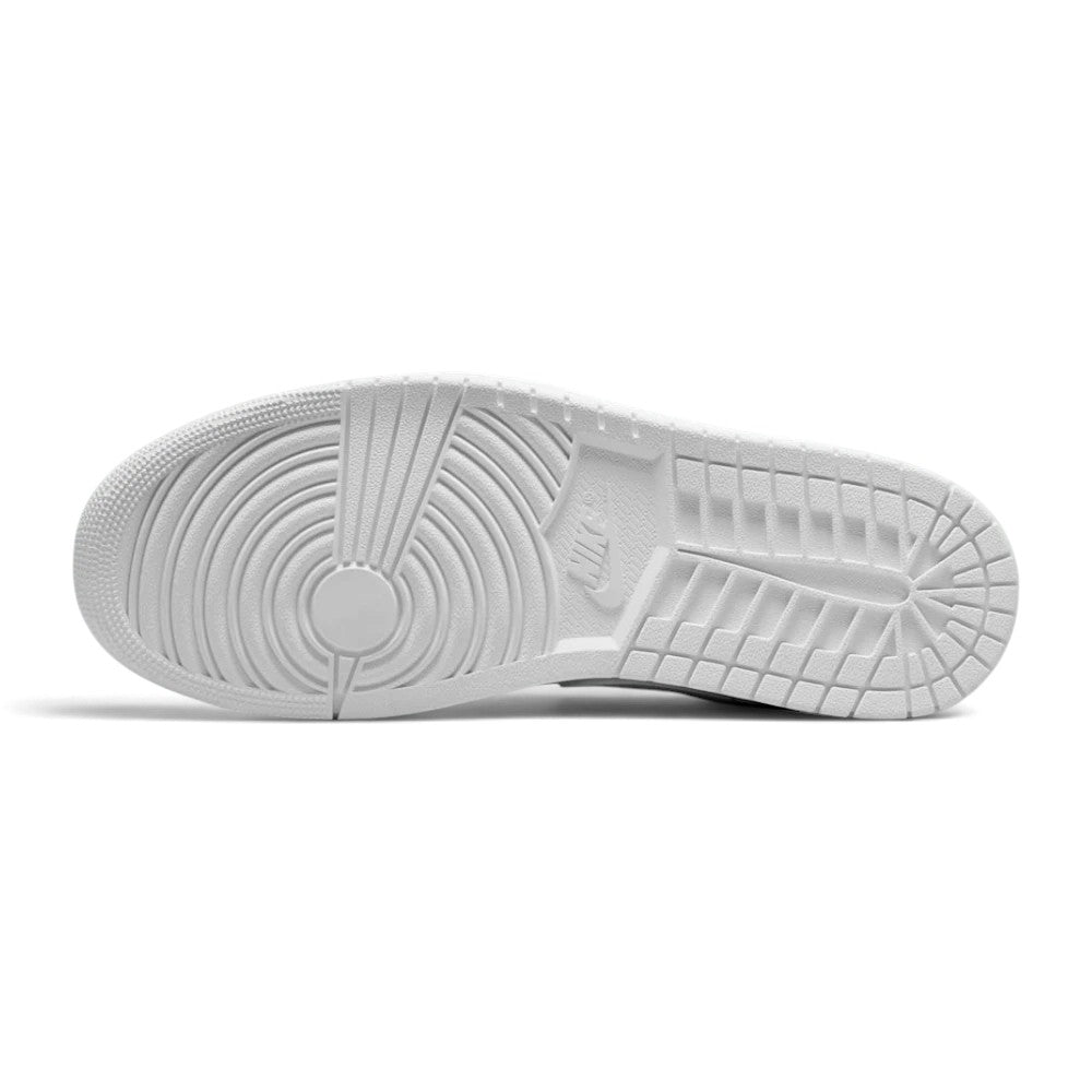 Bottom profile of the sneaker displaying the solid rubber outsole with concentric circle traction pattern.