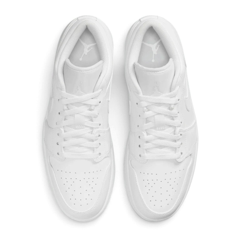 Overhead view of both Air Jordan 1 Low sneakers showing the adjustable lace-up closure, perforated toe box, and branded tongue labels.