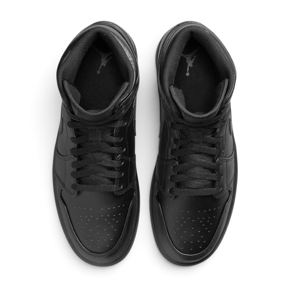 Focuses on the locked-in traditional lacing layout, displaying the perfect symmetry of the matte black cotton laces, the tonal textile tongue, and the iconic starburst perforation pattern tracking down the front leather toe box area.