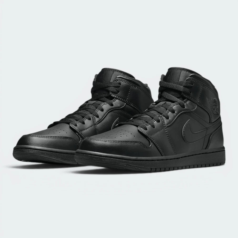 Emphasising the legendary, high-top court stance of the trainers and the professional, stealthy harmony of the blacked-out multi-paneled leather framework.