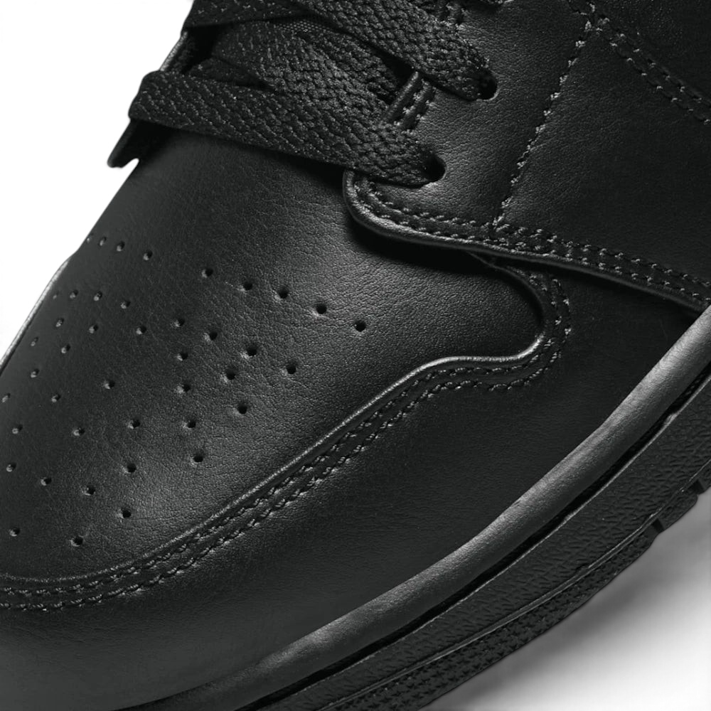 Details the premium precision of the double-stitched leather panels framing the toe cap overlay protection matrix, displaying how beautifully the laces track over the soft textile tongue.