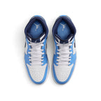 Overhead view of both mid-top sneakers showing the central lacing system, perforated toe boxes, and insoles printed with Jumpman branding.