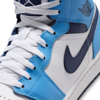 Macro focus on the forefoot and eyestay, detailing the fine leather grain, flat white laces, and reinforced stitching lines.