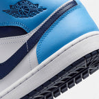 Close-up of the lateral heel transition, highlighting the embossed Wings ankle logo, crisp white midsole sidewall, and rubber cupsole tread.