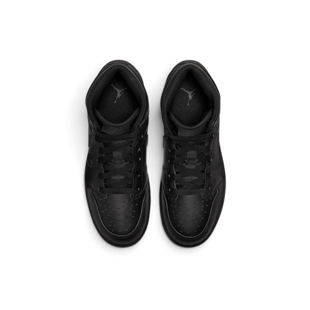 Overhead view of both sneakers showing the perforated forefeet, central lacing systems, and black insoles printed with grey Jumpman branding.
