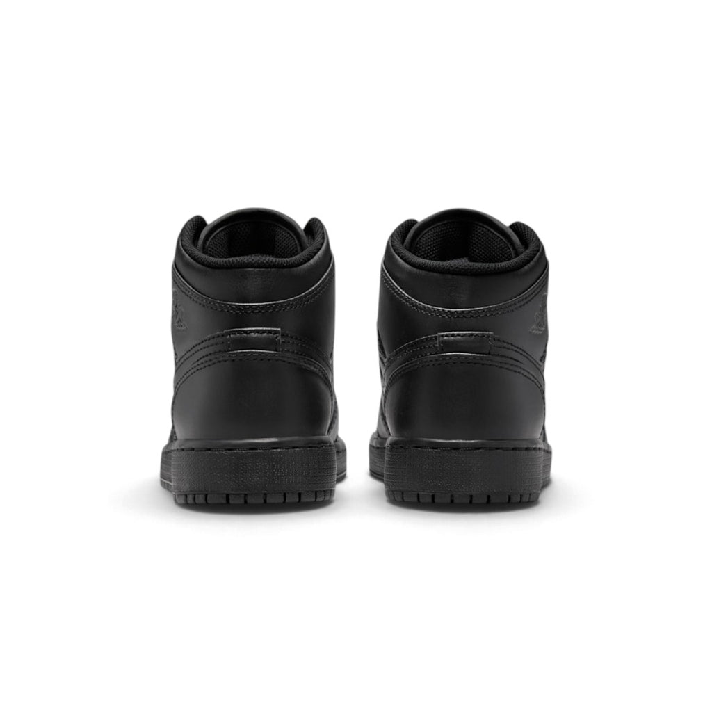 Rear view of the sneakers emphasizing the heel counter panels, ankle collar cushioning, and clean wrapped sole construction.