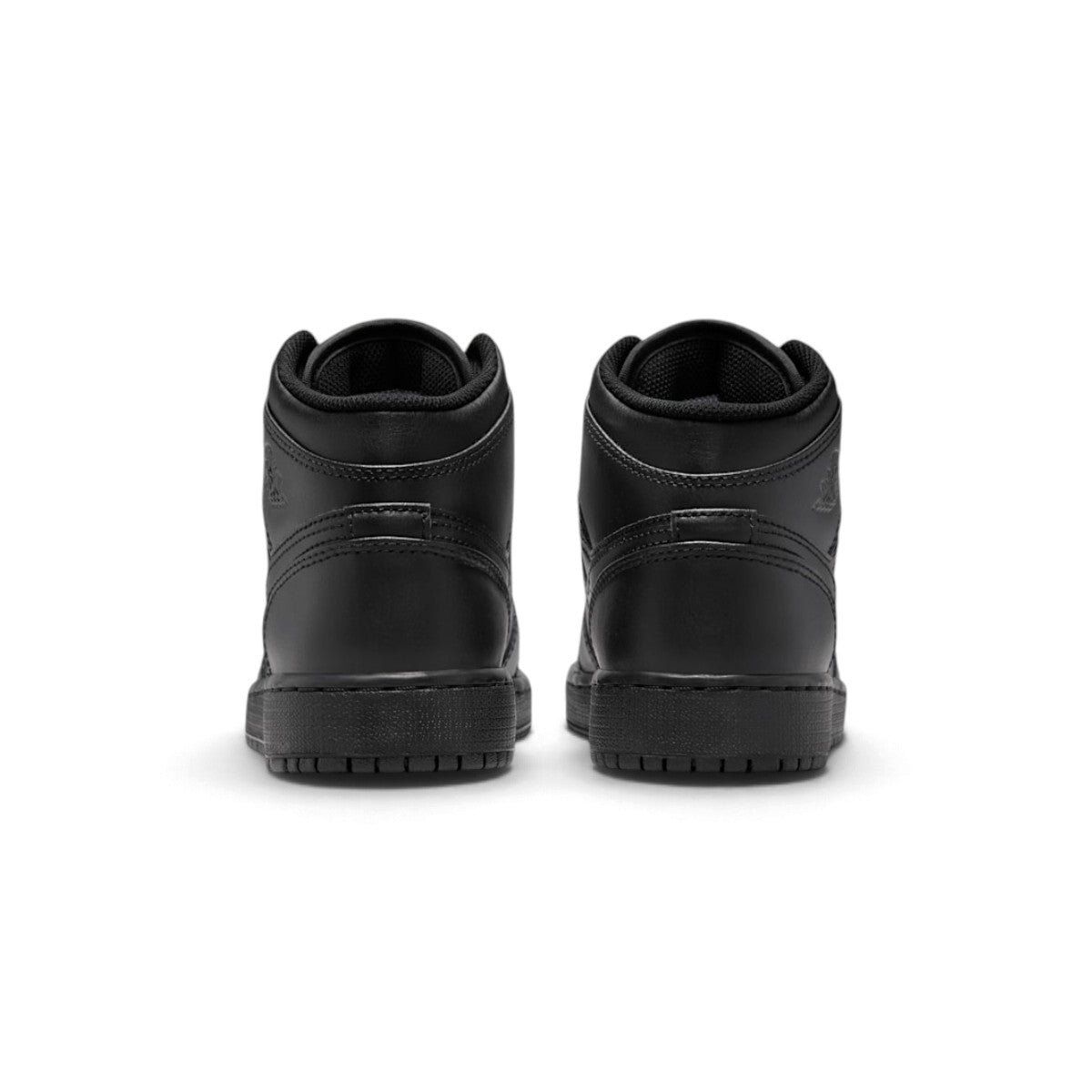 Rear view of the sneakers emphasizing the heel counter panels, ankle collar cushioning, and clean wrapped sole construction.