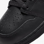 Macro focus on the forefoot and eyestay, detailing the perforated toe box leather texture, tonal stitching, and flat black laces.