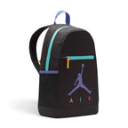 Displays the side profile of the backpack, showcasing the deep main compartment zip track in vibrant teal, the black mesh water bottle side pocket trimmed with purple, and the bold front graphics.