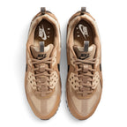 Focuses on the locked-in central lacing layout, displaying the Parachute Beige ripstop tongues, tonal laces, rugged TPU eyestay anchors, padded ankle collars, and insoles stamped with Nike Air branding.