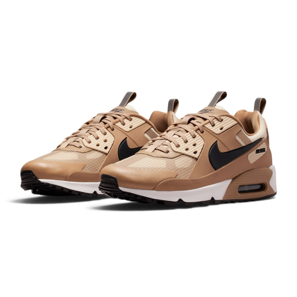 Highlights the inner profile displaying the layered ripstop underlays, textured black protective rubber cage, Light Khaki eyelet stays, and visible heel Air cushioning.