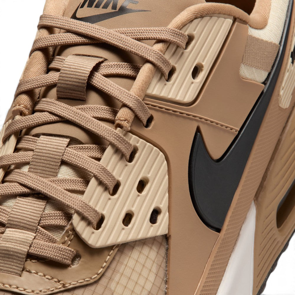 Details the micro-precision of the forefoot area, showing the durable ripstop toe box, reinforced synthetic toe bumper, tonal laces, and rugged lace loops.